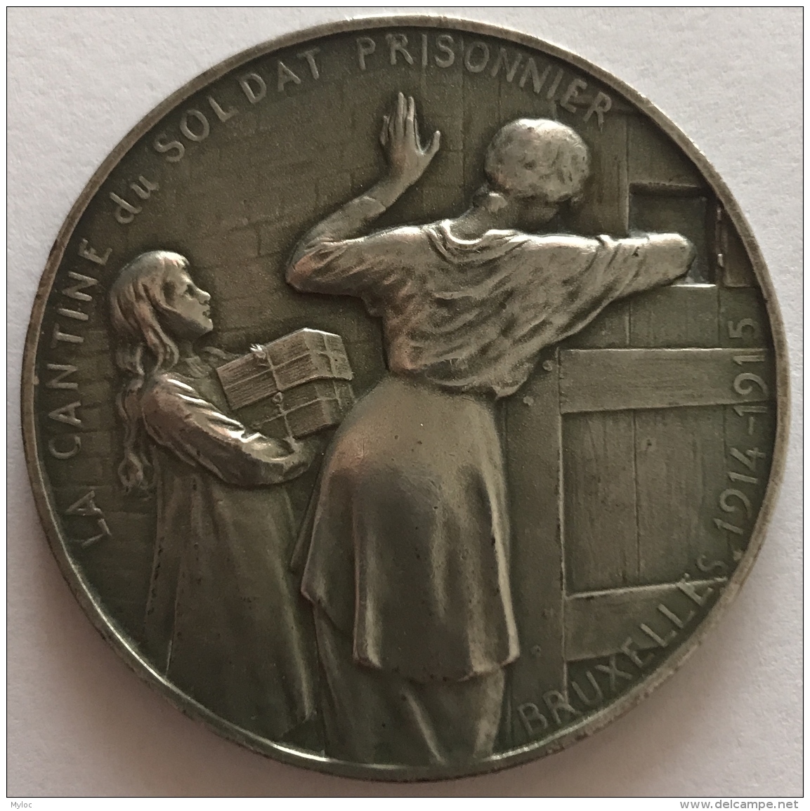 Médaille. Militaria. La Cantine Du Soldat Prisonnier. 1914-1915. G. Devreese. 55 Mm - 66 Gr - Professionals / Firms