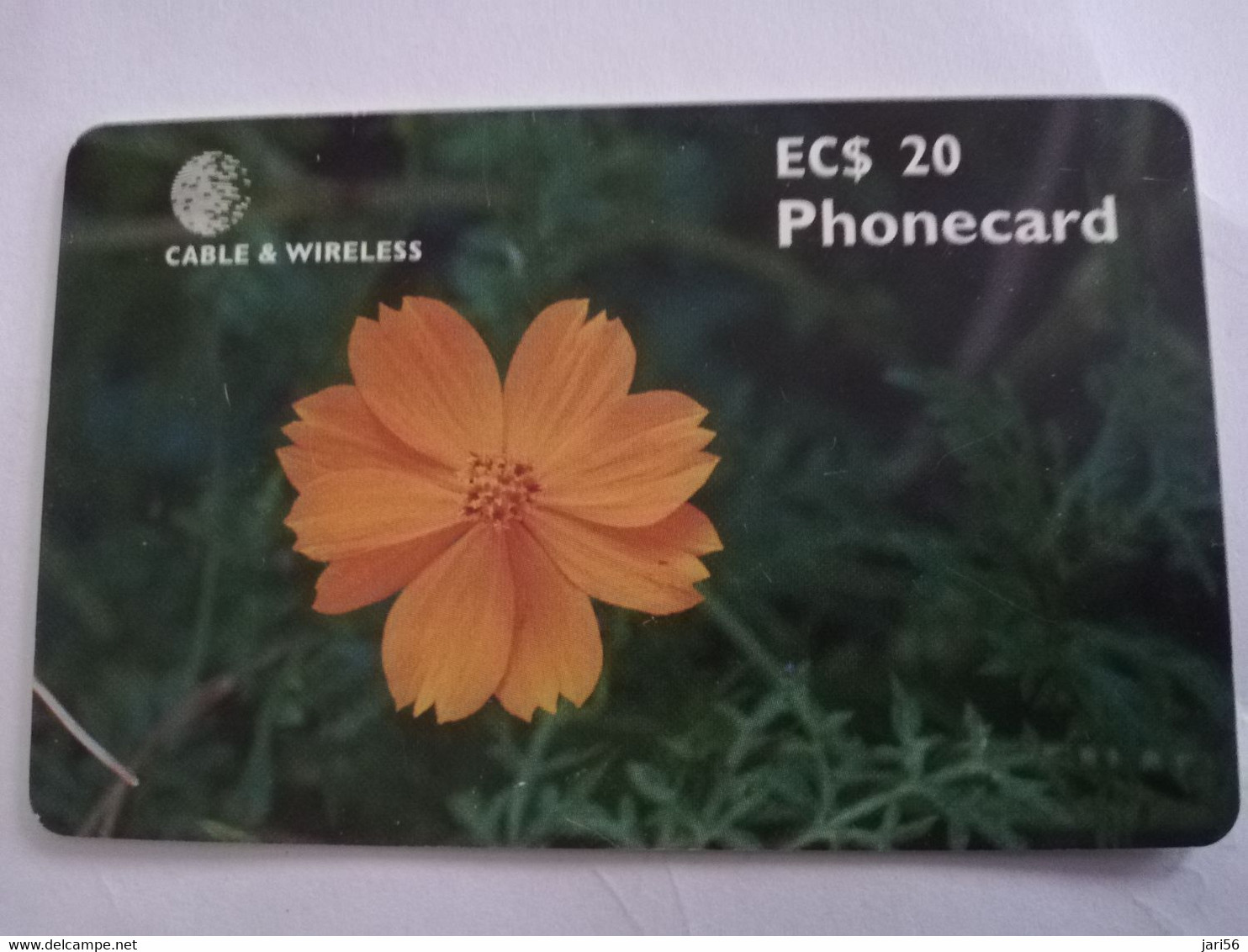 ANTIGUA  $20,- CHIPCARD FLOWER ORANGE COSMOS    Fine Used Card  ** 6720 ** - Antigua E Barbuda