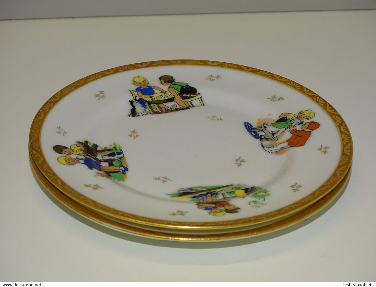 * 2 PETITES ASSIETTES PORCELAINE CHASTAGNER LIMOGES déco d'enfants Chiens 1930  E