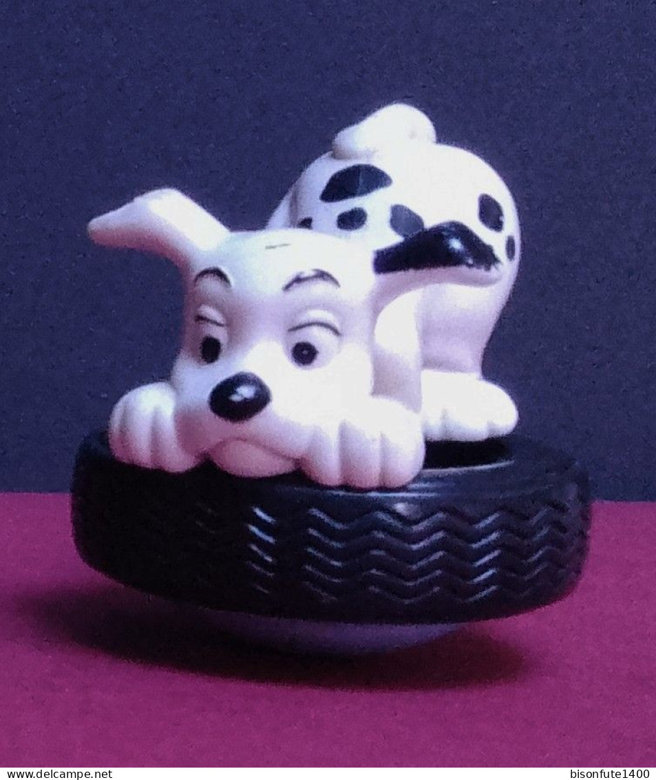 Figurine Des 101 Dalmatiens : Dalmatien Sur Un Pneu "toupie" ( Voir Photo ). - Disney