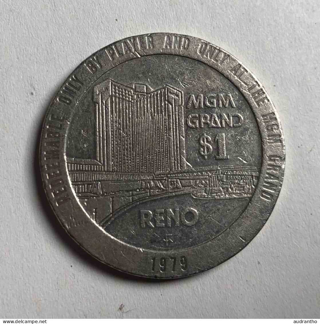 Jeton Etats-Unis - 1 Dollar Gaming Token - MGM Grand Casino RENO 1979 - Sonstige & Ohne Zuordnung