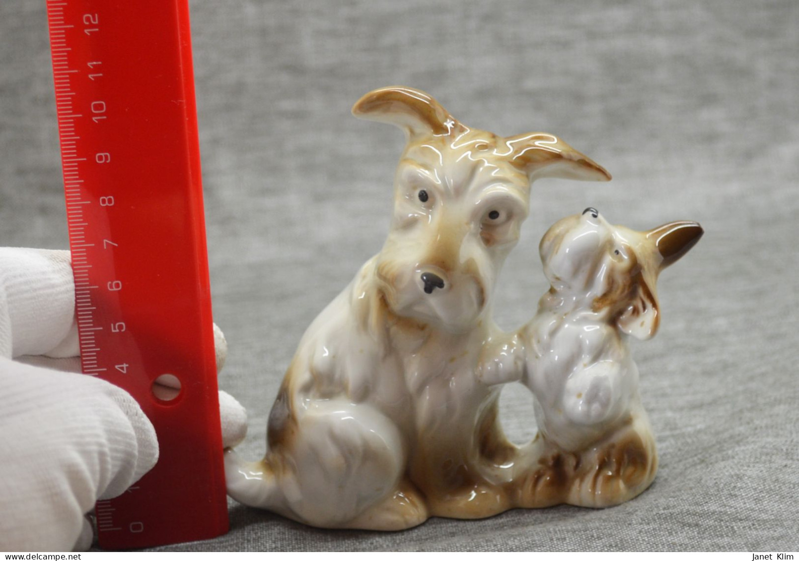 Vintage porcelain figurine of a dog with a puppy