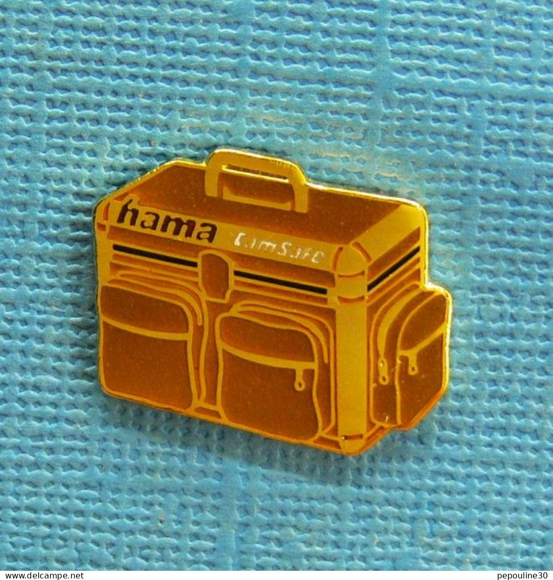 1 PIN'S // ** " HAMA " CAMSAFE / SAC POUR APPAREIL PHOTO ** - Fotografie