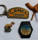 Lot De 4 Objets Vintage Publicitaire Cigarettes CAMEL Porte Clés Raid Aventure  Montre Fève Et Figurine Chameau - Autres & Non Classés