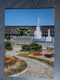 PEACE MEMORIAL HALL AND THE MONUMENT OF A MOTHER AND HER CHILDREN DASHING THROUGH A STORM - Hiroshima