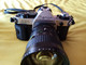 APPAREIL PHOTO CANON AE-1 PROGRAM + OBJECTIF MAKINON ZOOM 200MM + MOTEUR A + SACOCHE REPORTER ET NOTICE ET DIVERS - Cameras