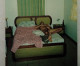 A Naked Man Is Lying On A Bed - Non Classés