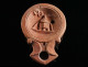 A Roman Terracotta Oil Lamp With A Cista/altar - Archaeology