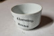 Tasse Publicitaire En Porcelaine Blanche Fleurie Vintage - Tasas