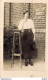 CARTE PHOTO NON IDENTIFIEE REPRESENTANT UNE JEUNE FEMME EN EXTERIEUR - A Identifier