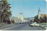 Bozeman MT Vintage Chrome Street Scene Postcard, 1940s Autos, Hotel Baxter, Church, Lumber Company - Bozeman
