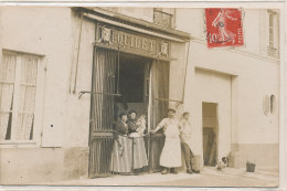 QQM 859 A  / CARTE PHOTO -ANET ( 28 ) BOUCHERIE QUIDET  ?????  GRANDE RUE  OU RUE PRINCIPALE  ????? (VOIR DOS   ) - Anet