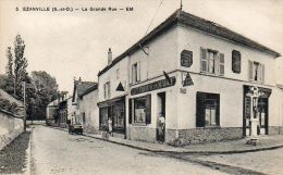 CPA - EZANVILLE (95) - Vue De La Grande Rue ,du Café Tabac Et De La Pompe-Colonne Schell - Ezanville