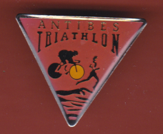 53350- Pin's.Antibes Triathlon.cyclisme.natation.athletisme.course. - Biathlon