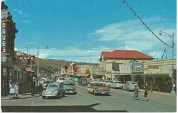 KAMLOOPS - B.C. A VIEW OF MAIN STREET SHOWING VW BEETLE, MORRIS MINOR ETC.  GUESS 1960's - Kamloops