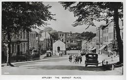 Real Photo Postcard, Appleby, The Market Place, Street, Houses, Shops, Automobile, Car, People. - Appleby-in-Westmorland