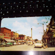 SECOND STREET AND BUSINESS DISTRICT LOOKING NORTH OLD CARS PARIS CAFE  HESTED STORES - Laramie