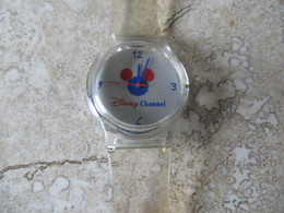 Montre Publicitaire DISNEY CHANEL Bracelet Plastique Transparent En état De Fonctionnement Si Pile Operationelle. - Montres Publicitaires