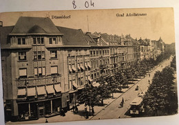 Cpa écrite En 1920, Düsseldorf, Graf Adolfstrasse, Animée, Enseignes Commerciales, Tramway, Tricycles Etc, ALLEMAGNE - Duesseldorf