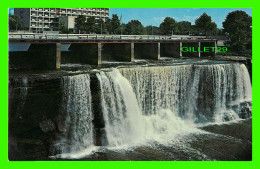 OTTAWA, ONTARIO - THE RIDEAU FALLS WITH THE CITY HALL IN BACKGROUND - PHOTO BY MALAK - NATIONAL NEWS CO - - Ottawa