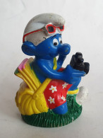 FIGURINE BOUCHON PRIME BIP 1996 SCHTROUMPF PHOTOGRAPHE APPAREIL PHOTO NOIR - Smurfs