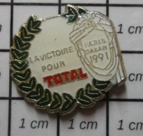811A Pin's Pins / Beau Et Rare / CARBURANTS / VICTOIRE POUR TOTAL RALLYE PARIS-DAKAR 1991 RALLYE LAURIERS - Fuels