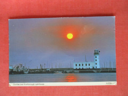 Sunrise.  Scarborough  Lighthouse.   England > Yorkshire > Scarborough  Ref 6410 - Scarborough