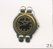 Pin's Montre / Montre “Bertolucci“ Pour Bijouterie De Lyon (69). Est. Bertolucci Lyon Elixyr. N# 252. Zamac. T1008-21 - Parfum