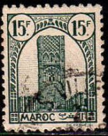 Maroc (Prot.Fr) Poste Obl Yv:221 Mi:205 Tour Hassan Dent 12 G.brillante (cachet Rond) - Used Stamps