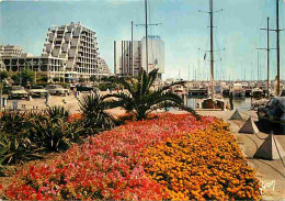 34 - La Grande Motte - Les Jardins, Le Port Et Les Pyramides - Automobiles - Fleurs - CPM - Voir Scans Recto-Verso - Autres & Non Classés