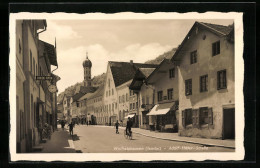 AK Wolfratshausen /Isartal, Strasse Mit Geschäften Und Kirche  - Wolfratshausen