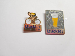 2 Beaux Pin's , Bière , Beer Buckler , Cyclisme Team Buckler - Bierpins
