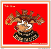 RARE Pin's CINEMA-COCHON : CHARLIE Un Film De DON BLUTER Visuel "COCHON" En émail Grand Feu Base Or  3,4X2,5cm - Kino